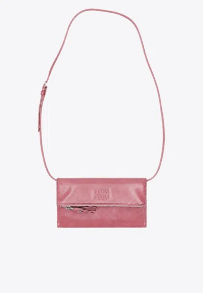 Miu Miu Embossed Logo Clutch Bag In Brown