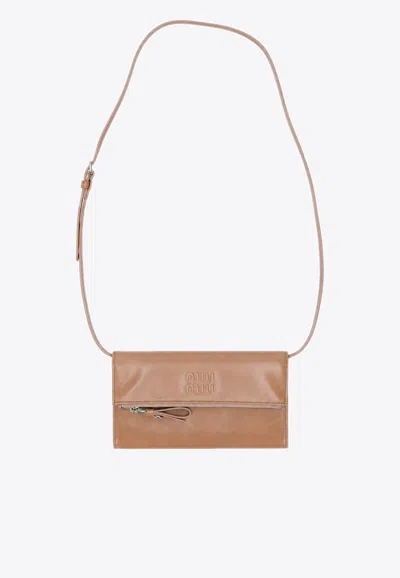 Miu Miu Embossed Logo Clutch Bag In Pink