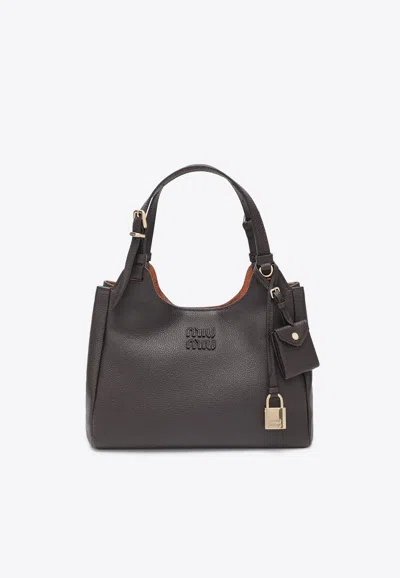 Miu Miu Embossed Logo Hammered Leather Shoulder Bag In Brown