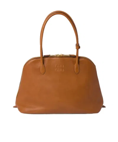 Miu Miu Embossed-logo Tote Bag In Brown