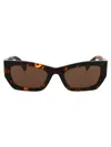 Miu Miu Eyewear Rectangular Frame Sunglasses In Vau06b Honey Havana
