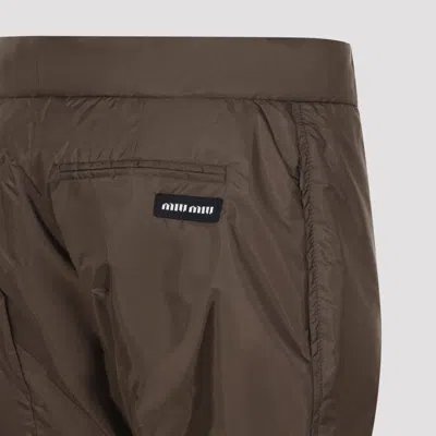 Miu Miu Flared Technical Nylon Pants With Buttoned Hems In F0192 Ebano