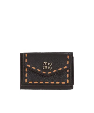 Miu Miu Flip Wallet In Brown