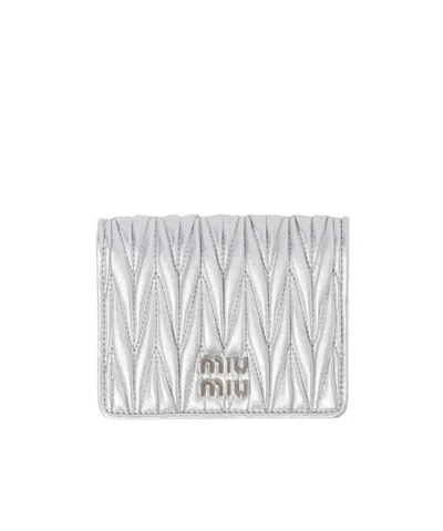 MIU MIU MIU MIU LOGO-LETTERING MATELASSÉ BI-FOLD WALLET
