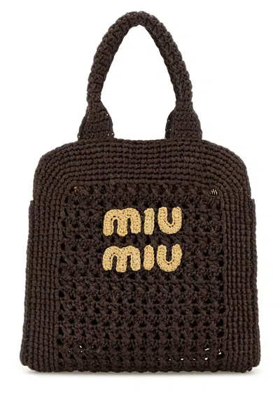 Miu Miu Handbags. In Brown