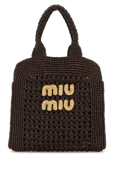 Miu Miu Handbags. In Brown