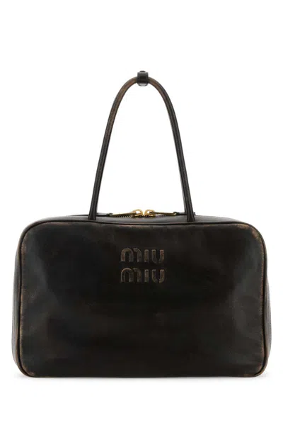 Miu Miu Handbags. In Black