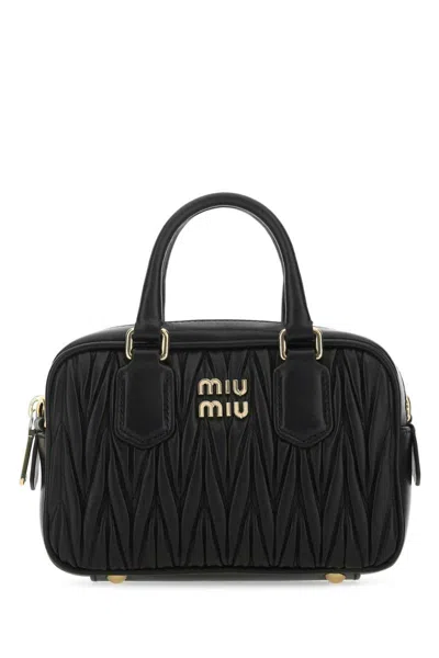 Miu Miu Handbags. In Black