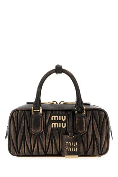 Miu Miu Handbags. In Brown