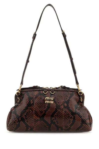 Miu Miu Handbags. In Brown