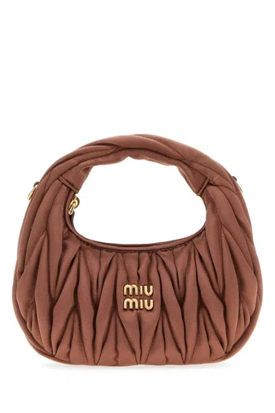 Miu Miu Handbags. In Brown