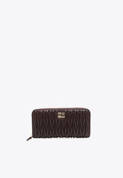 Miu Miu Large Matelassé Leather Wallet In Brown