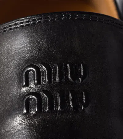 Miu Miu Leather Logo Loafers In Black