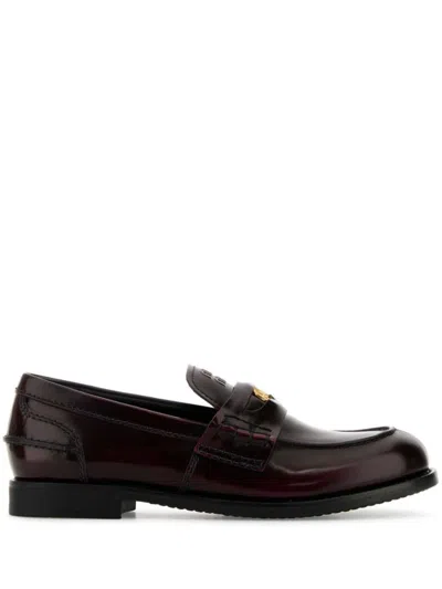Miu Miu Logo Embossed Calf Leather Loafers In Brown