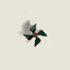 Miu Miu Leather Pinwheel Brooch In Green