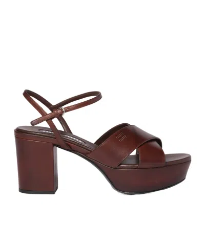 MIU MIU MIU MIU LOGO-EMBOSSED PLATFORM SANDALS
