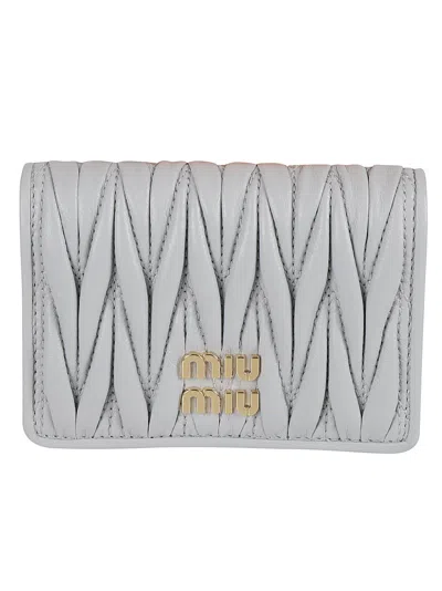 Miu Miu Logo Buttoned Bifold Wallet In Fiordaliso