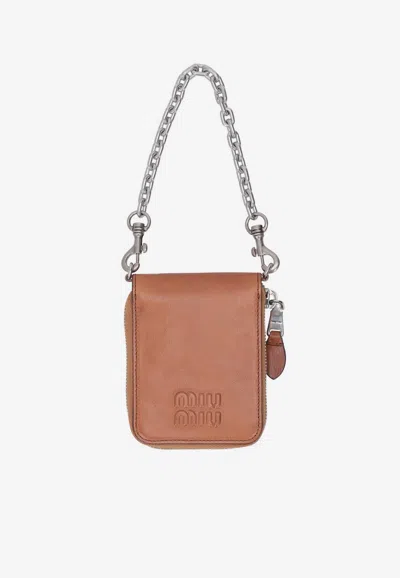 Miu Miu Logo Embossed Chain Wallet In Brown