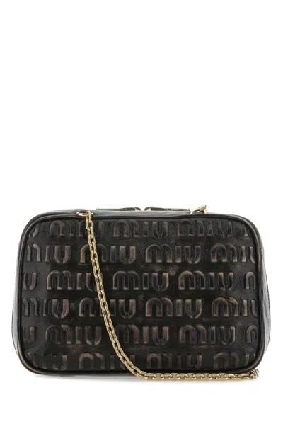 Miu Miu Logo Embossed Zipped Shoulder Bag In Black