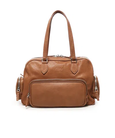 Miu Miu Logo-embossed Zipped Tote Bag In Brown