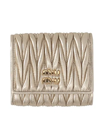 Miu Miu Logo-lettering Matelassé Wallet In Pirite
