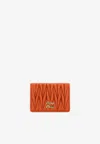 Miu Miu Logo Plaque Matelassé Leather Cardholder In Orange