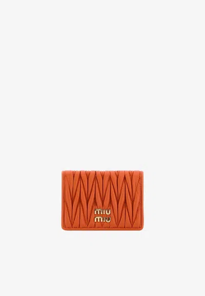 Miu Miu Logo Plaque Matelassé Leather Cardholder In Orange
