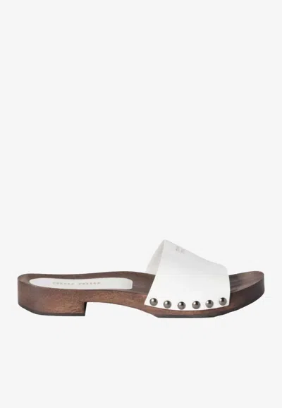 Miu Miu Logo Plaque Patent Leather Slides In White