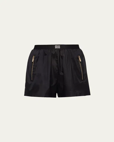 Miu Miu Logo-print Technical Silk Shorts In Nero