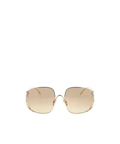 Miu Miu Logo Sunglasses In Gold