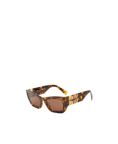 Miu Miu Eyewear Collection Sunglasses In Coffee Lenses