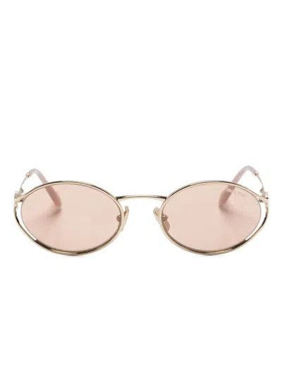 Miu Miu Logo Sunglasses In Pale Gold