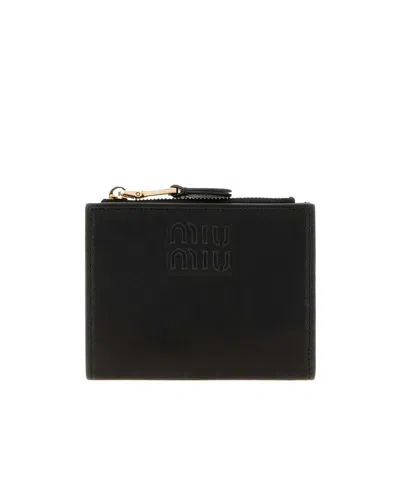 Miu Miu Logo-embossed Zip-fastening Wallet In Black