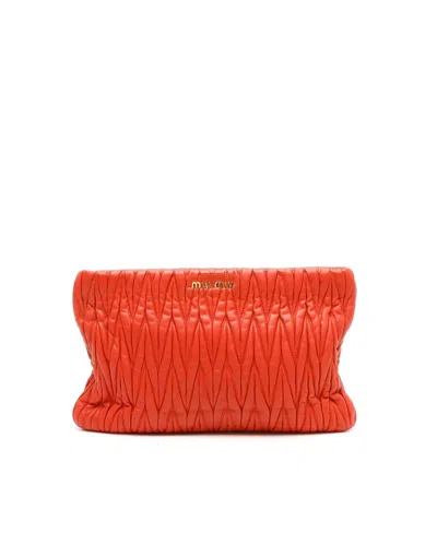 Miu Miu Matelasse Clutch Bag In Orange
