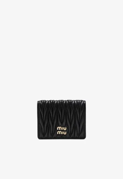 Miu Miu Matelassé Leather Logo Wallet In Black