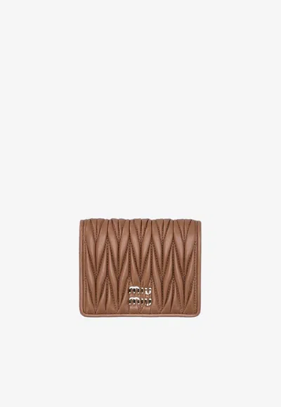 Miu Miu Matelassé Leather Logo Wallet In Brown