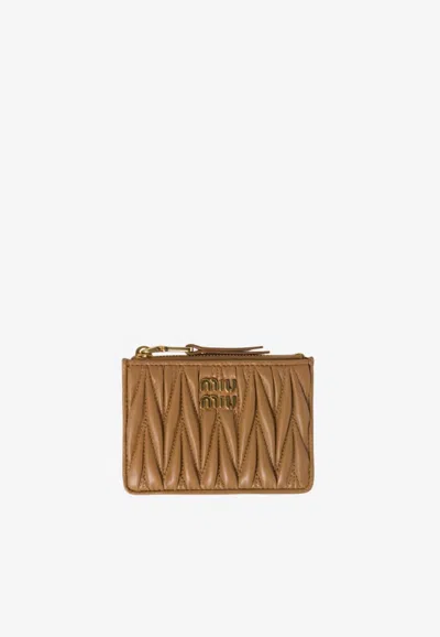 Miu Miu Matelassé Leather Logo Zip Cardholder In Brown