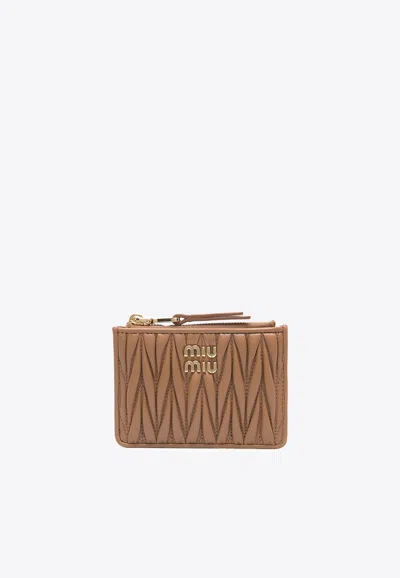Miu Miu Matelassé Leather Logo Zip Cardholder In Brown