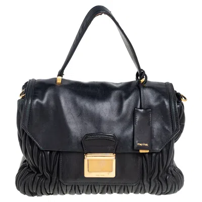 Miu Miu Matelassé Leather Push Lock Top Handle Bag In Black