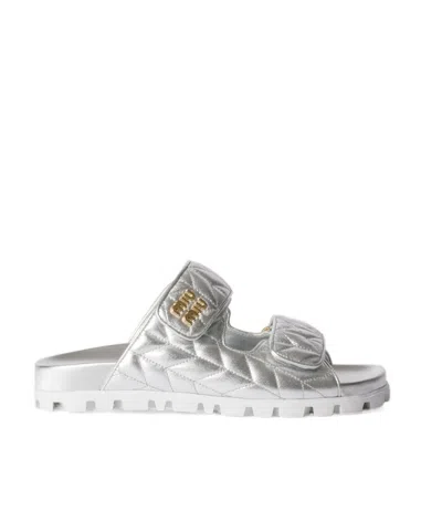 Miu Miu Metallic Matelassé Nappa Leather Slides In Silver