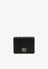 Miu Miu Quilted Leather Wallet With Lettering Logo On The Front In Black