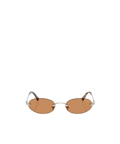 Miu Miu Oval Sunglasses In Brown