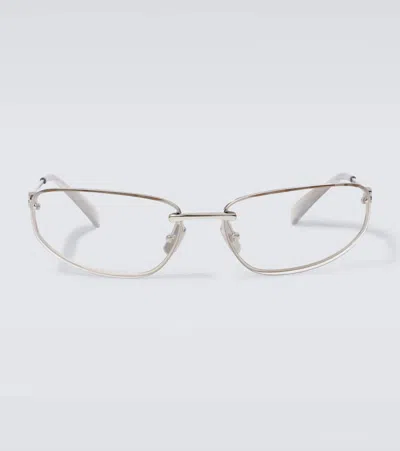 Miu Miu Oval Sunglasses In Silver