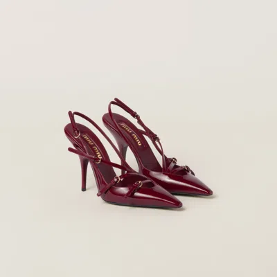 MIU MIU PATENT LEATHER SLINGBACKS WITH BUCKLES