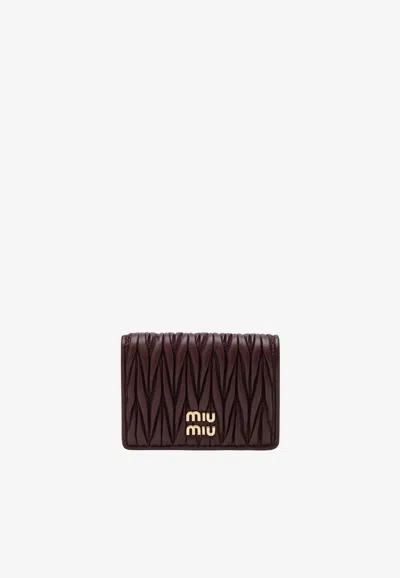 Miu Miu Quilted Compact Wallet In Burgundy