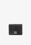 Miu Miu Small Matelassé Nappa Leather Wallet In Brown