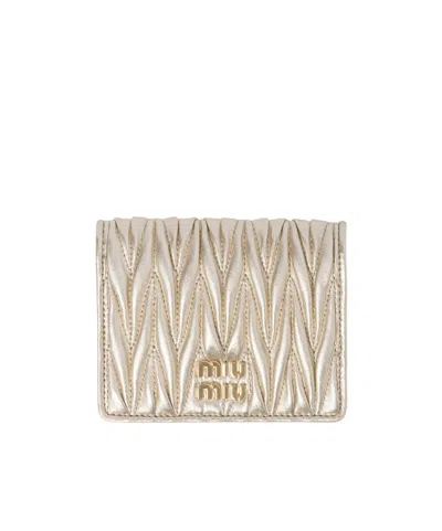MIU MIU MIU MIU LOGO-LETTERING MATELASSÉ BI-FOLD WALLET