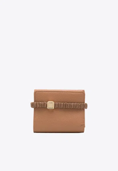 MIU MIU SMALL TRI-FOLD LEATHER WALLET