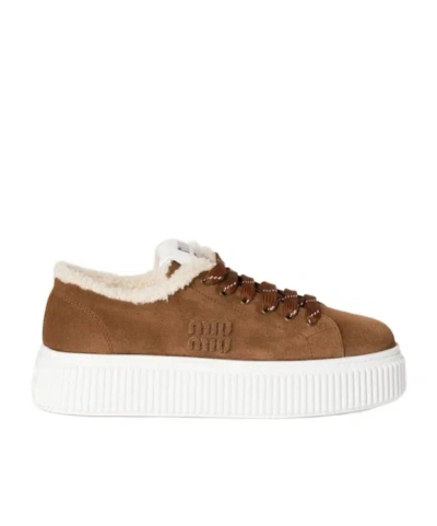 MIU MIU SUEDE AND SHEARLING SNEAKERS