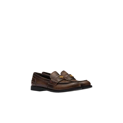 Miu Miu Logo Embossed Calf Leather Loafers In Brown